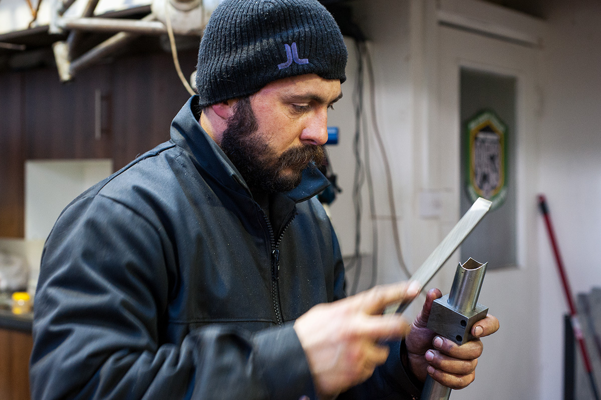 Ted James filing smooth the milled edge of a seat tube