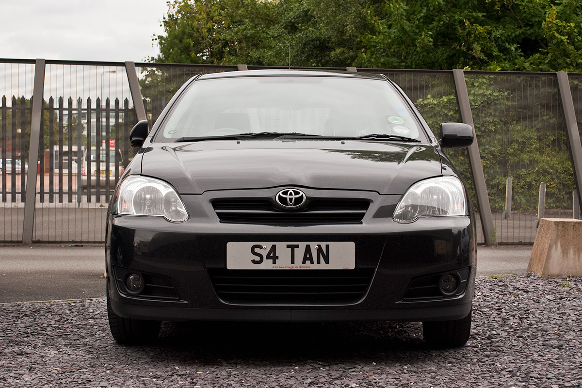 A small car with the number plate S4TAN