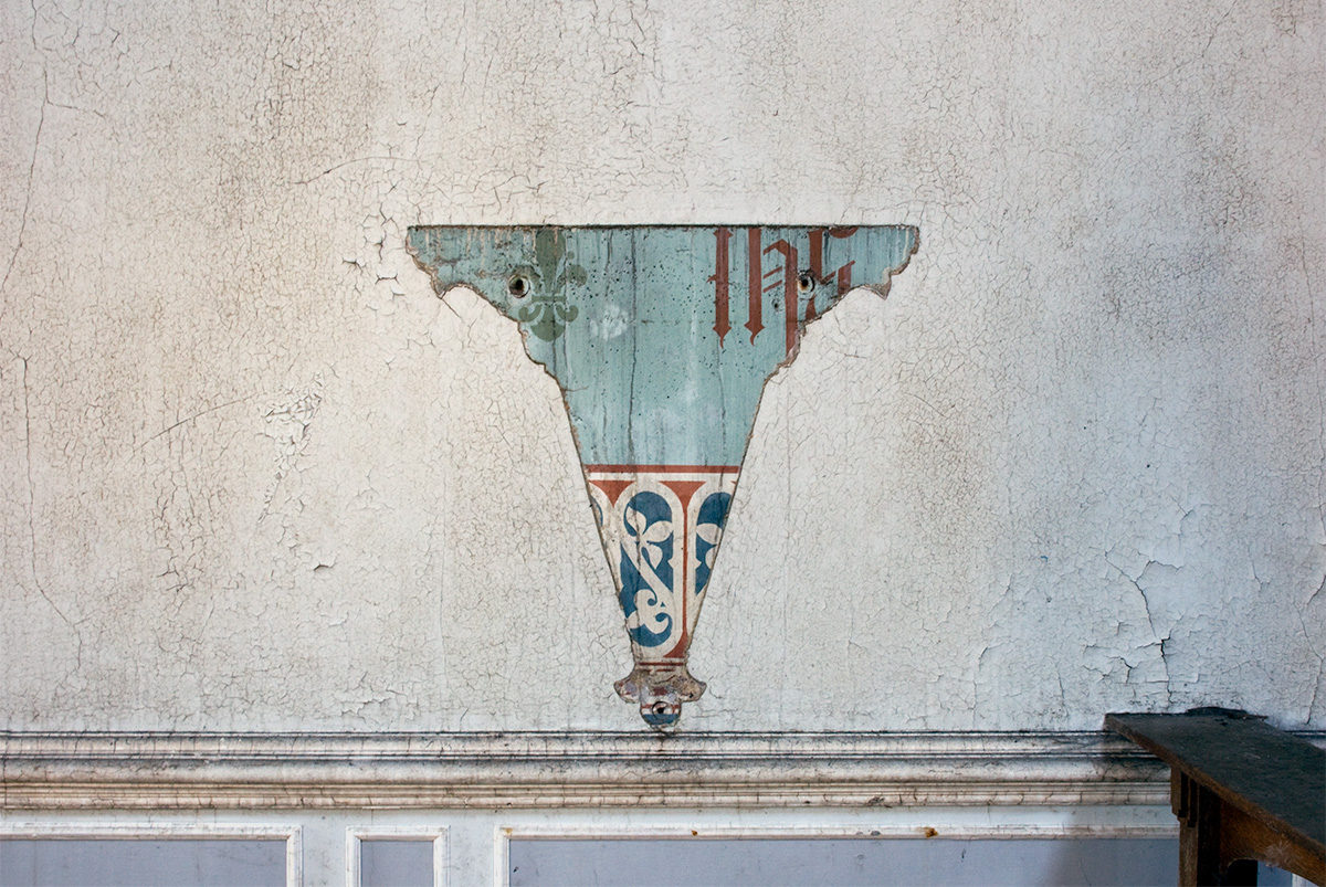 A void in paintwork after the removal of a fixture at Whittingham Asylum