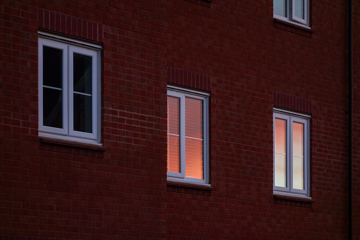 Sunset reflected in house windows