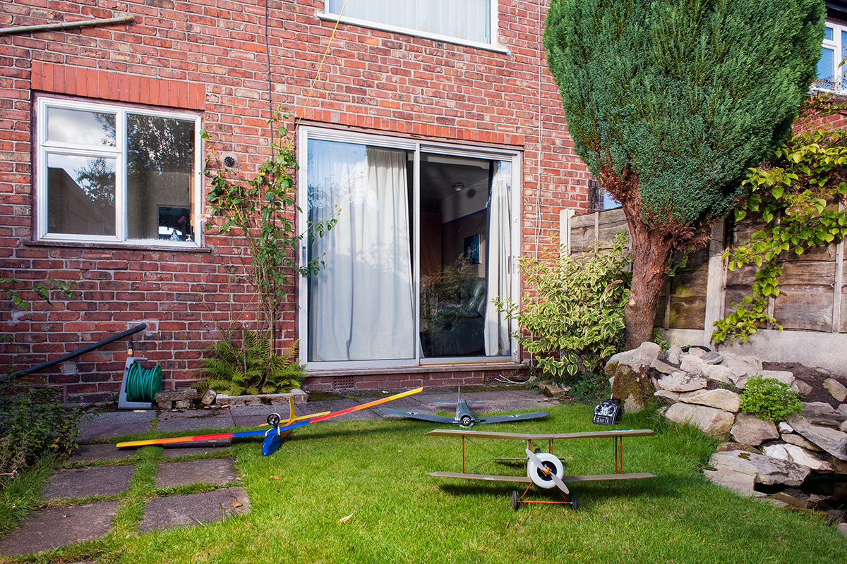 Radio controlled model aircraft in a residential garden