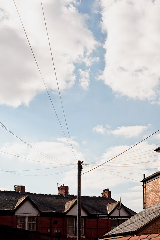 A telegraph pole in great light, in Rusholme, Manchester