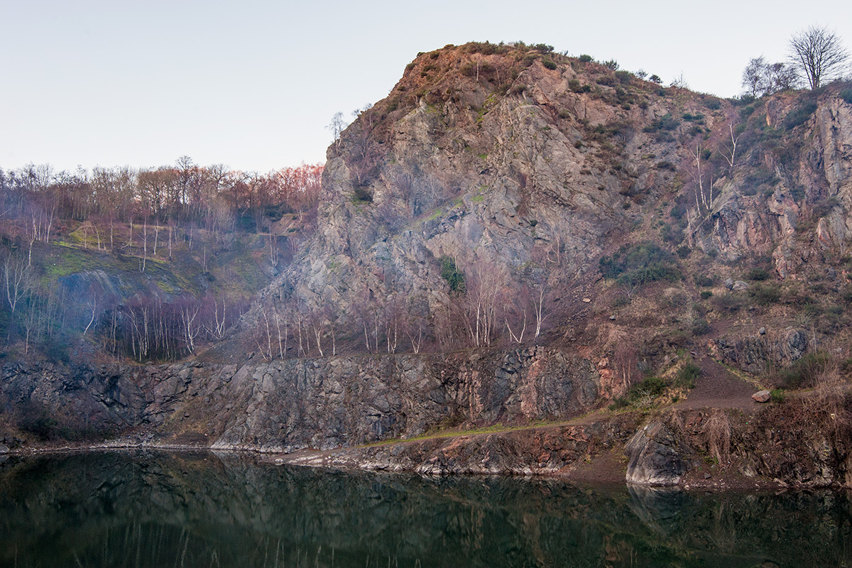 Light woodsmoke drifting across Gullet Quarry