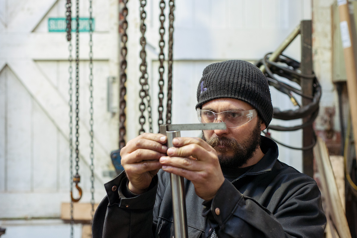 Ted James checking the straightness of the end of a cut tube