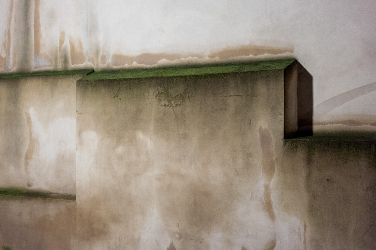 A concrete wall in Greenwich viewed at night