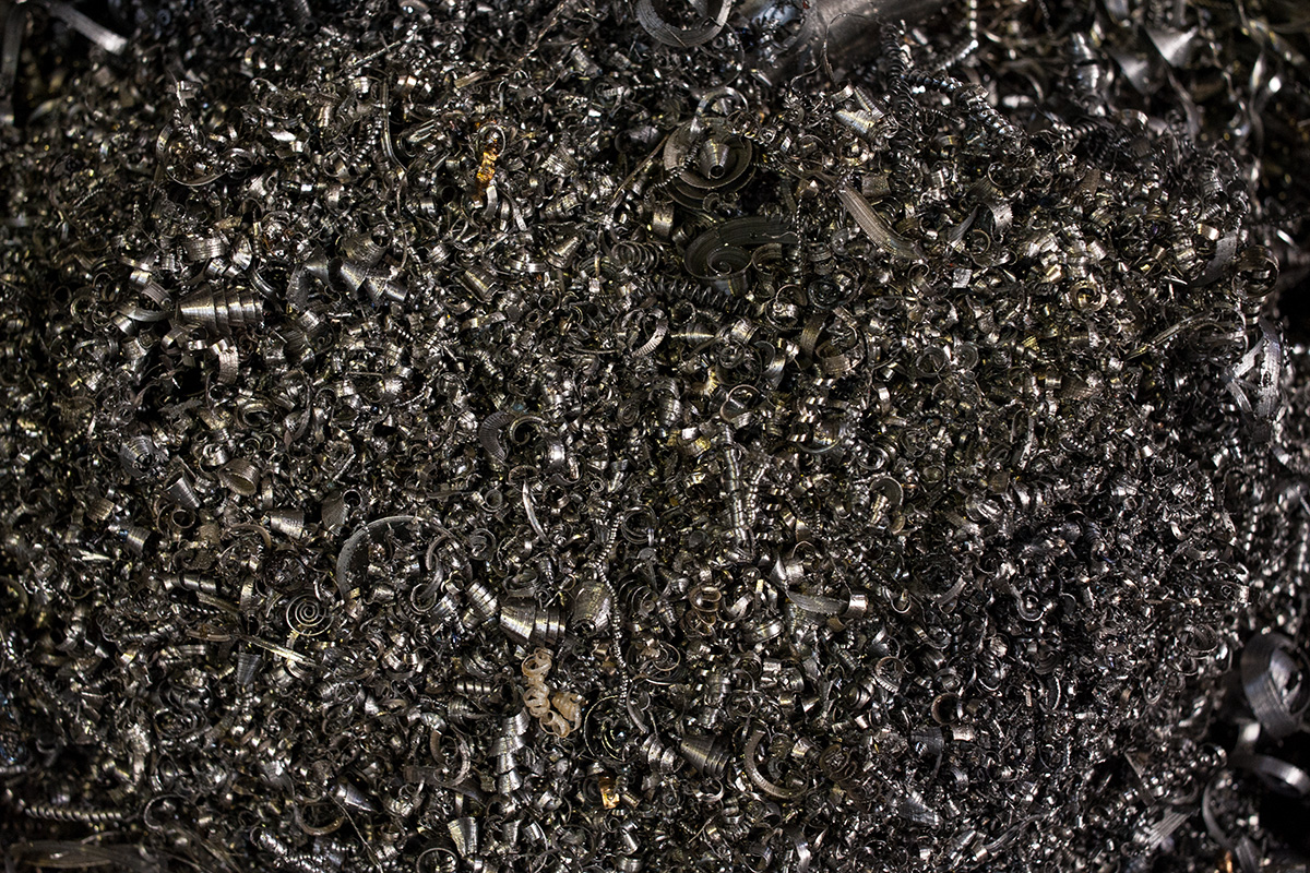 A bin of swarf from a lathe at Ted James Design, Stroud