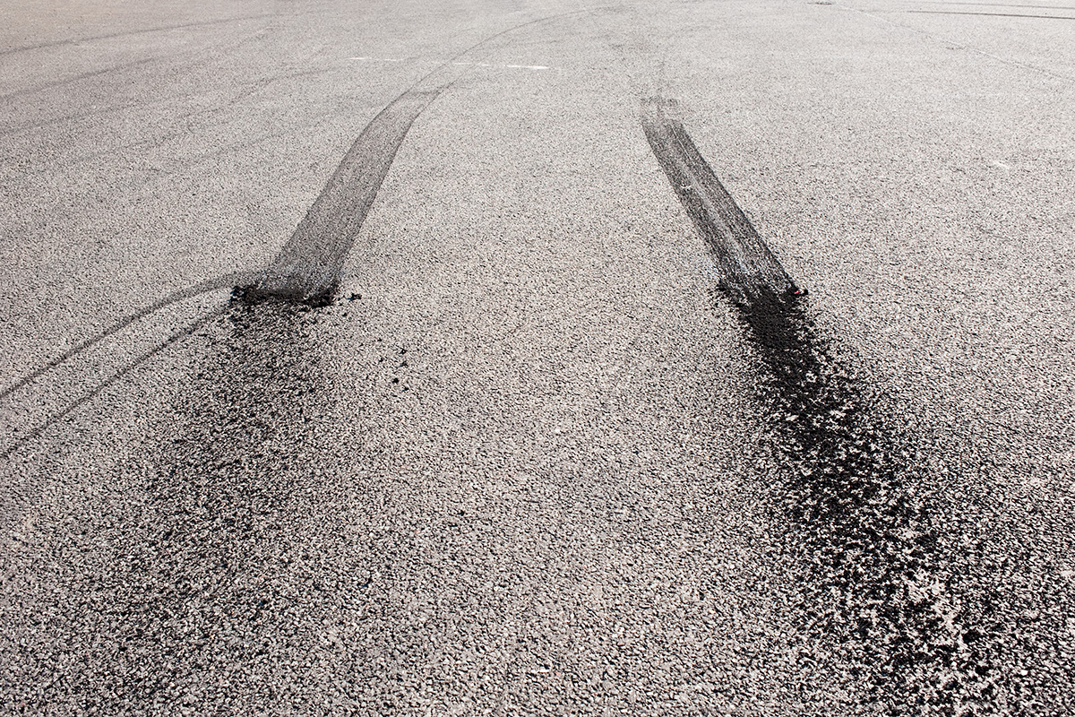 Rubber tyes marks and spatter from a standing burnout outside the Team Japspeed headquarters