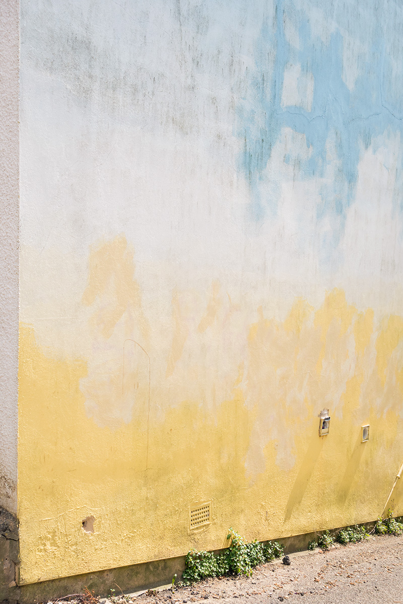 A colourfully painted stucco wall in Stroud, Gloucestershire