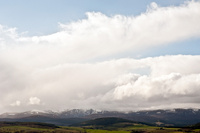 The fields and snow covered peaks of the Black Isle