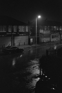 Withington during a thunderstorm, reminiscent of film noir