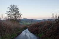 A country lane leading to Great Malvern and West Malvern, with the Malvern Hills beyond