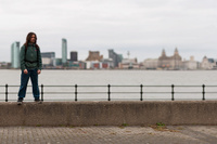 Brian on the Wallasey waterfront, with Liverpool beyond