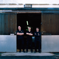 Brewers at the entrance of Moorhouse's old brewery on its final day of operation