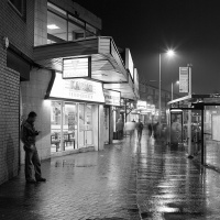 The Curry Mile at night during rain