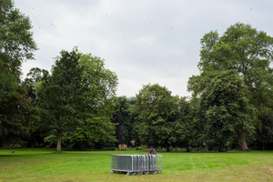 A man awaiting the collection of barriers used at the Caribbean Carnival, Alexandra Park, Moss Side