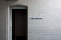 A sign giving directions to the depot management's offices