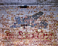 The remnants of a no smoking sign painted on a hangar wall at RAF Burtonwood, later USAF Burtonwood