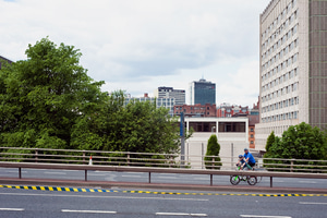A father and son participating in the Great Manchester Cycle, riding along the Mancunian Way where it crosses Upper Brook Street